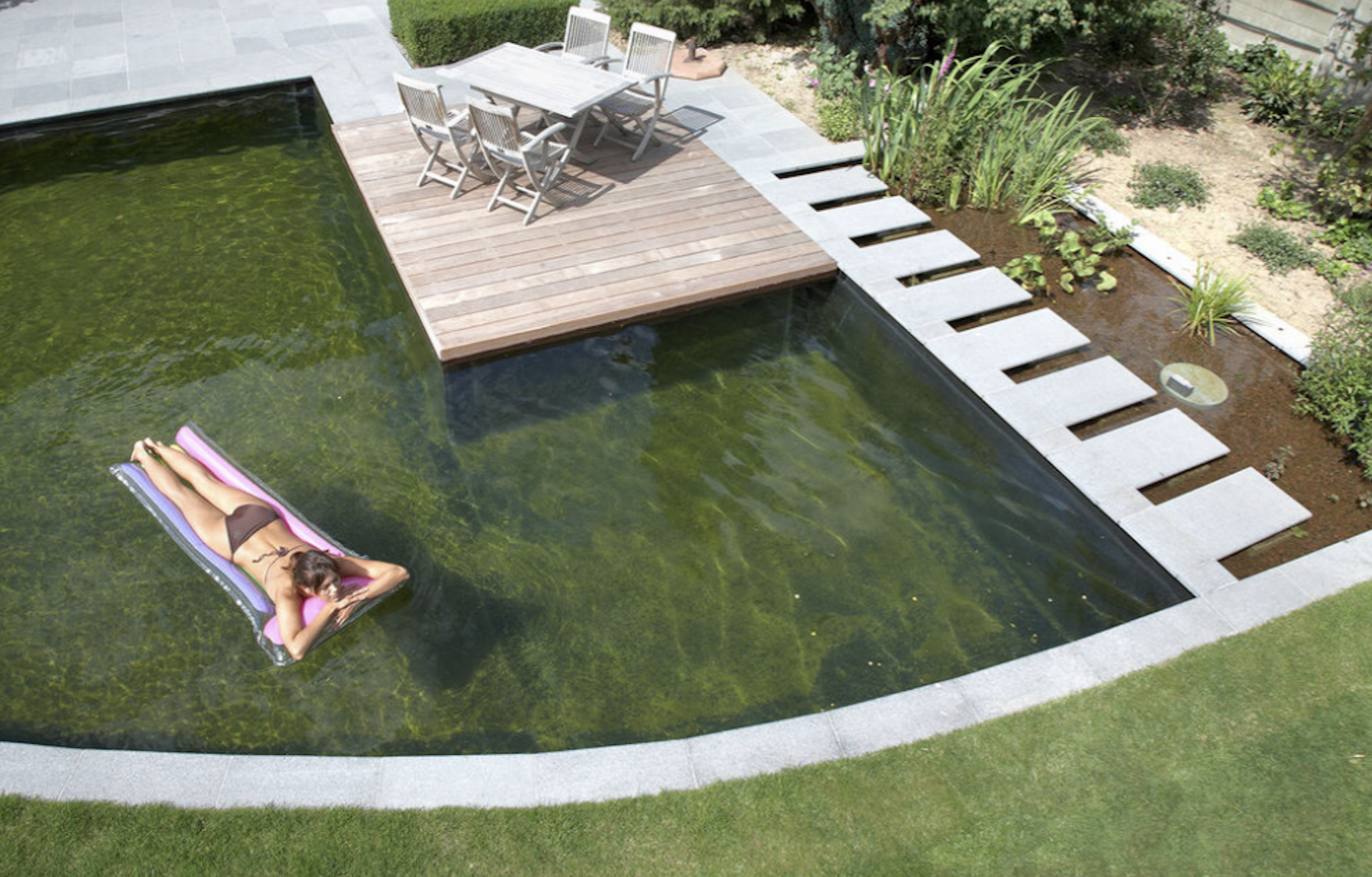 courtesy renolit natural swimming pool with person floating 1