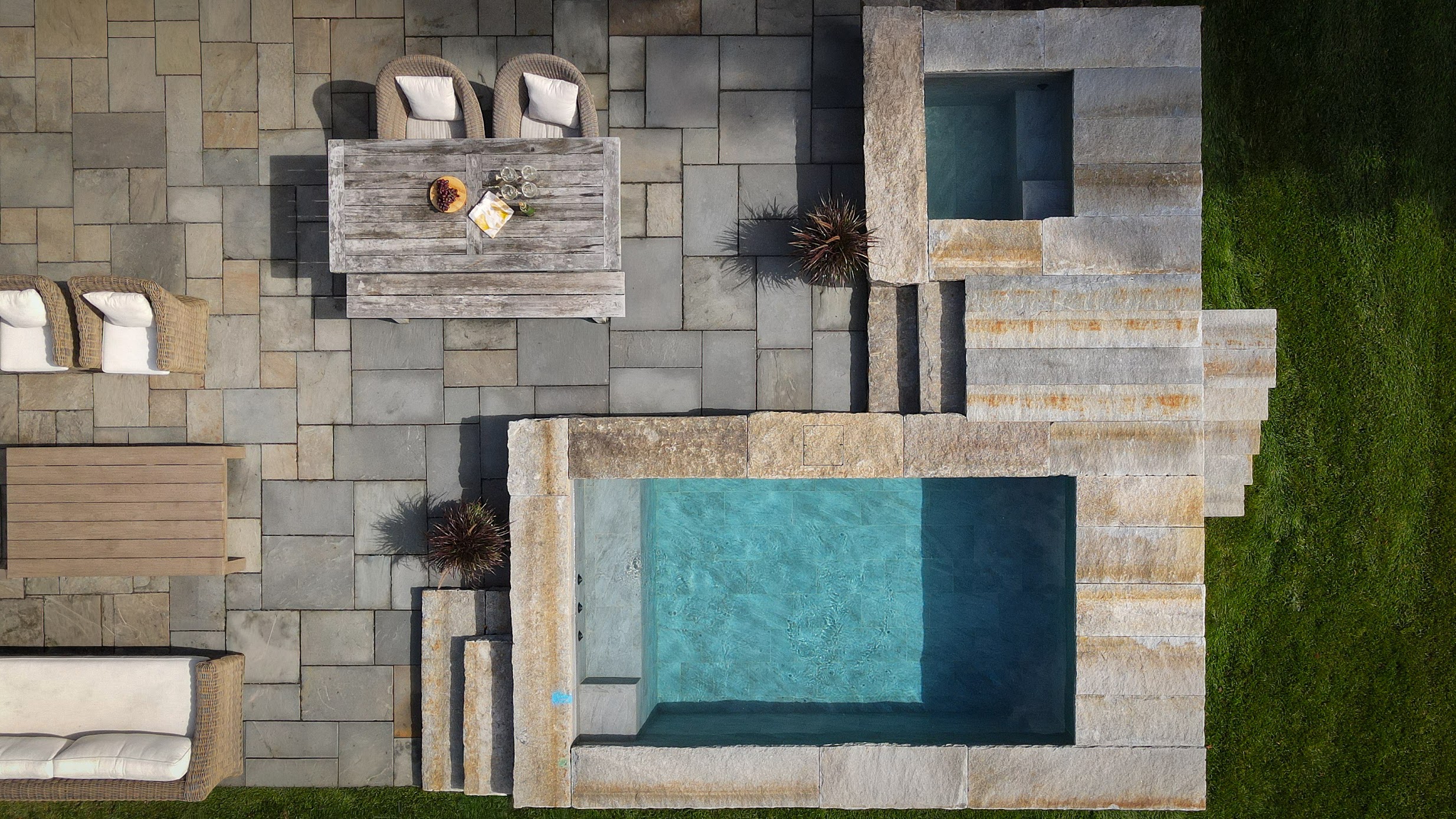 Overhead view of a Soake plunge pool and hot tub surrounded by stone coping