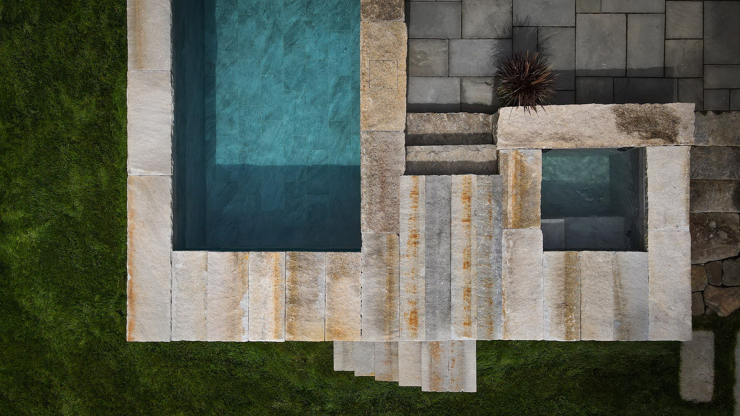 Soake plunge pool and hot tub beside a patio dining area